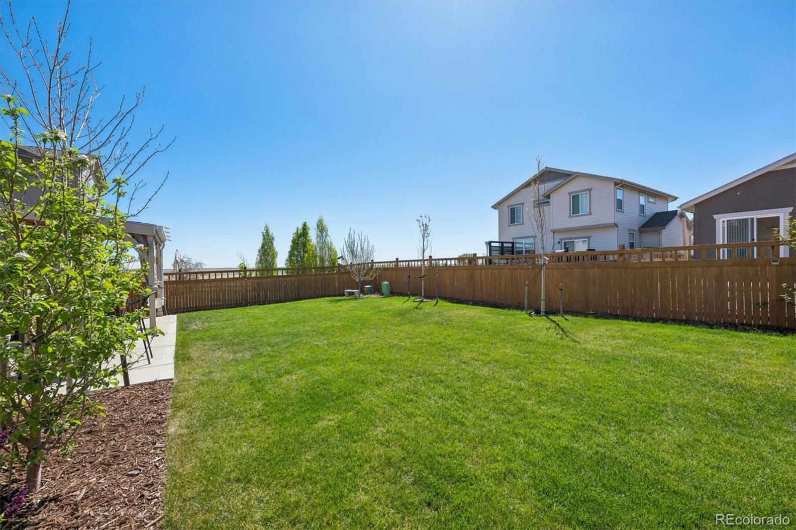 3530 Sawtooth Street Frederick, CO 80516 - Photo 29 of 36 a house with a big yard