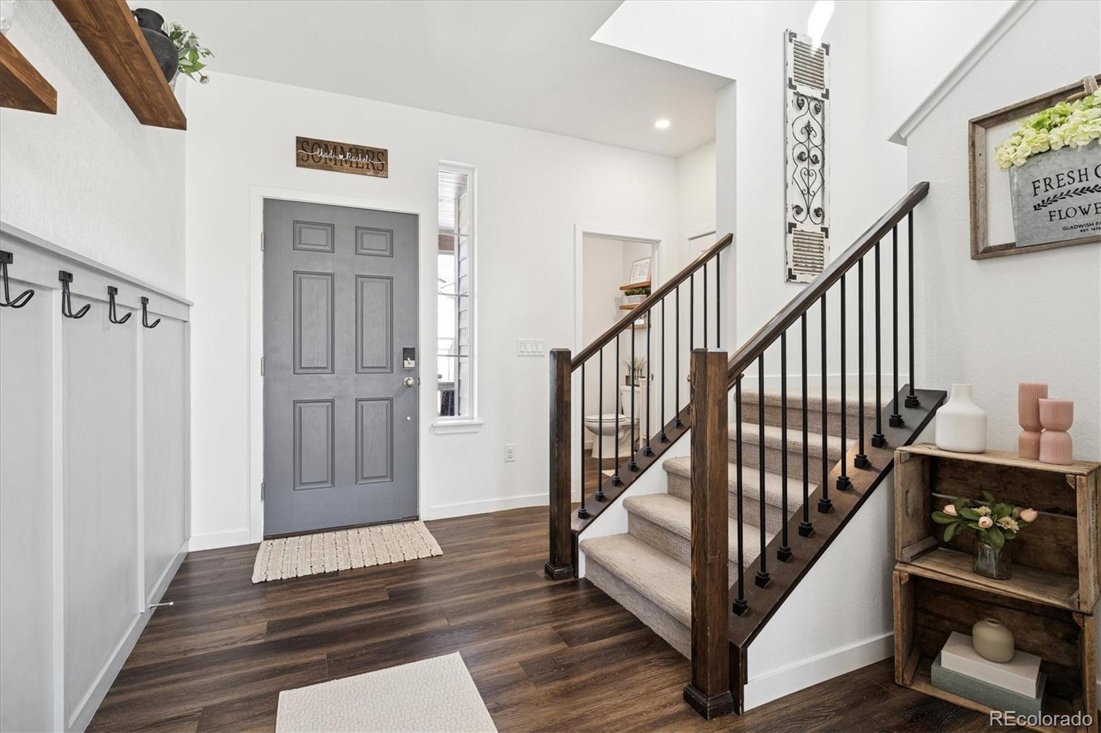 3530 Sawtooth Street Frederick, CO 80516 - Photo 3 of 36 a view of entryway and hall with wooden floor