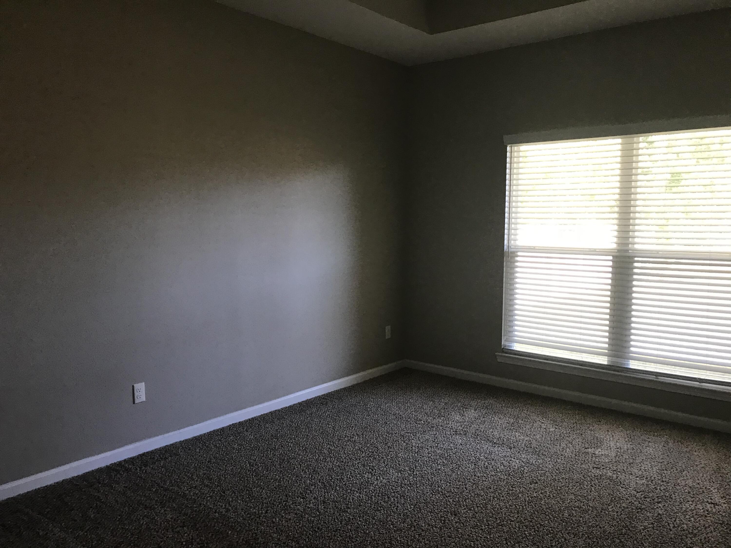 240 Dixie Street Crestview, FL 32536 - Photo 11 of 20 a view of an empty room with a window