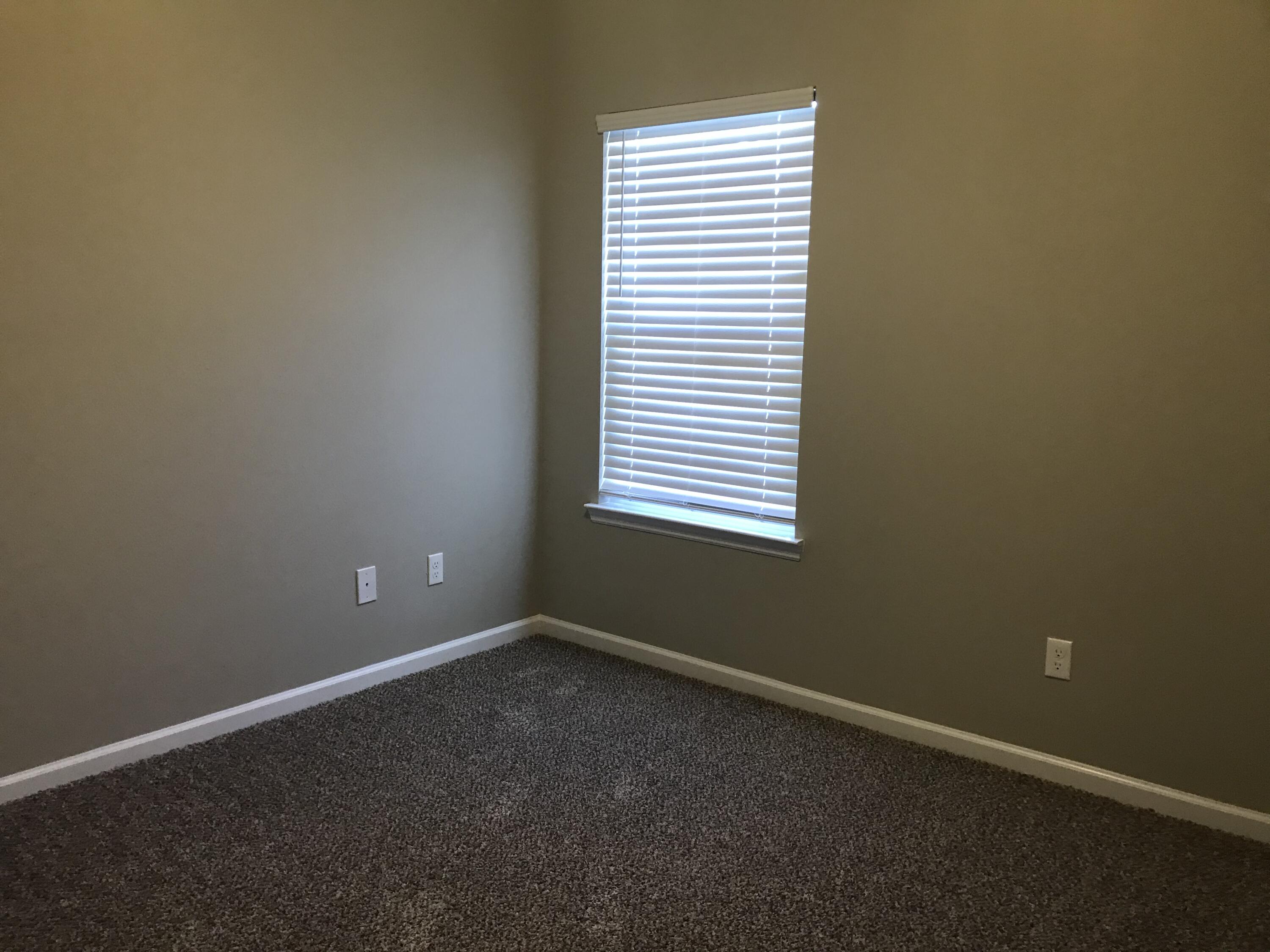 240 Dixie Street Crestview, FL 32536 - Photo 15 of 20 an empty room with a window