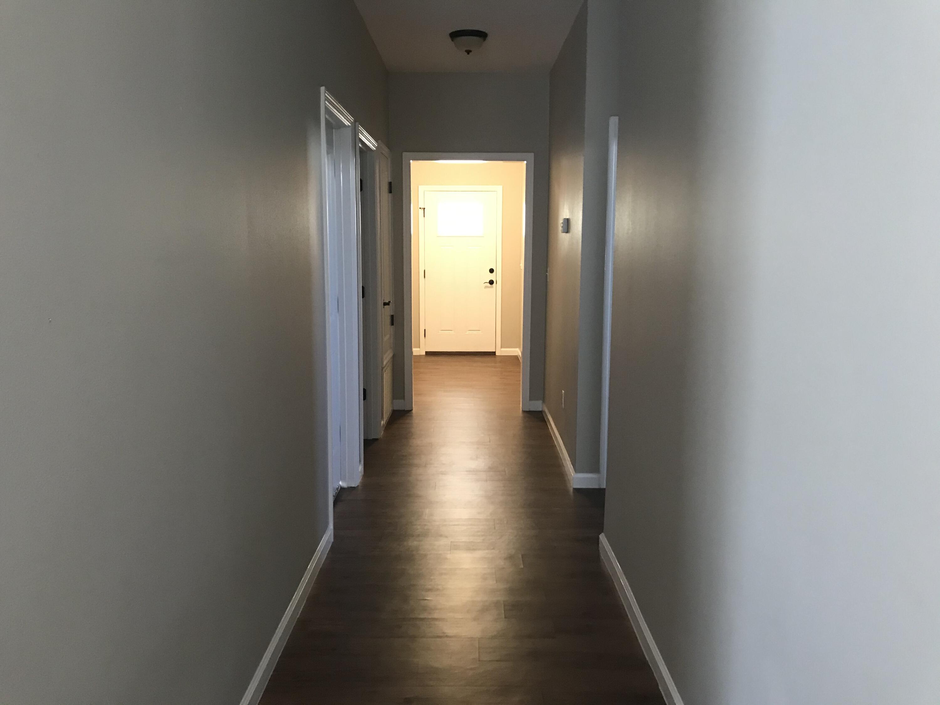 240 Dixie Street Crestview, FL 32536 - Photo 2 of 20 a view of a hallway with wooden floor