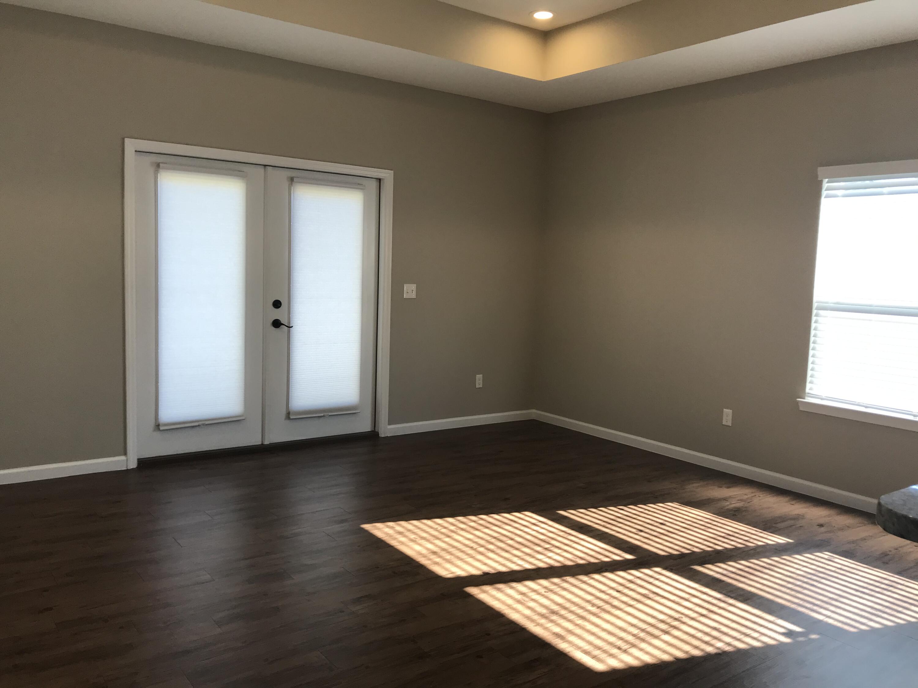 240 Dixie Street Crestview, FL 32536 - Photo 7 of 20 a view of wooden floor in an empty room