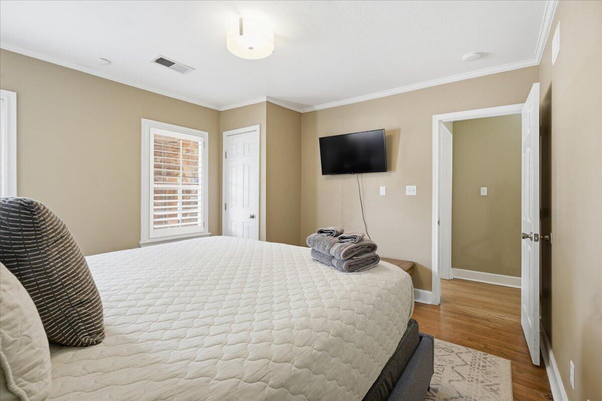 2702 20th Street Lubbock, TX 79410 - Photo 14 of 34 a bedroom with a bed and a television