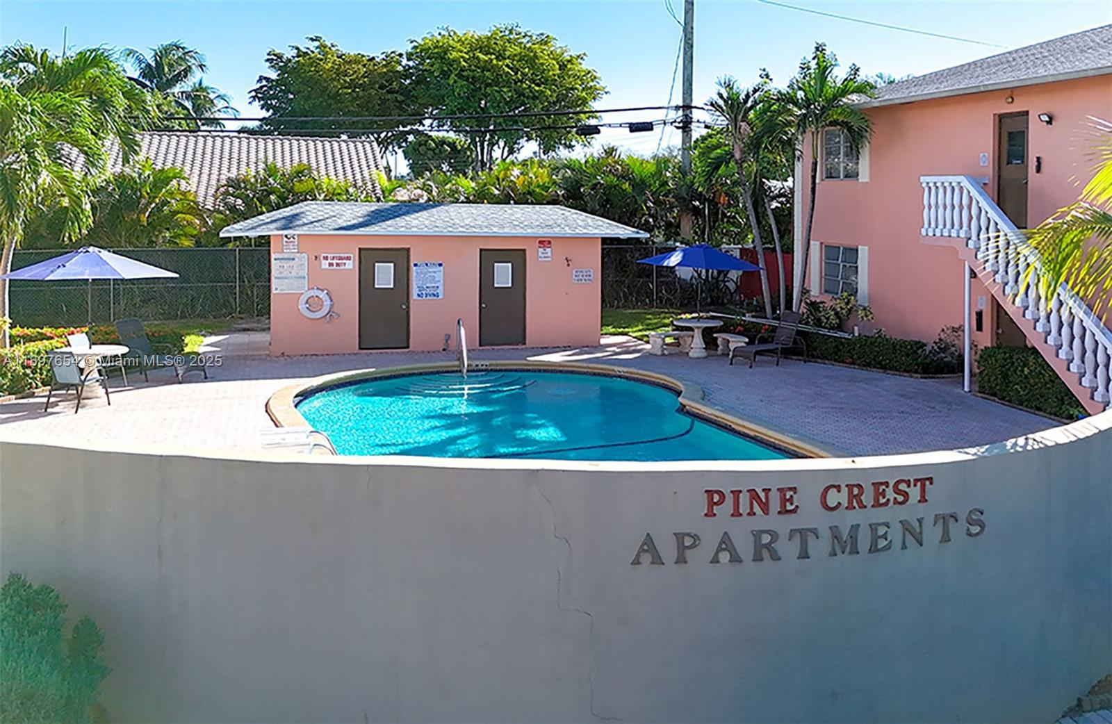 5990 Northeast 18th Avenue, Unit 505 Fort Lauderdale, FL 33334 - Photo 1 of 14 a view of a house with a yard