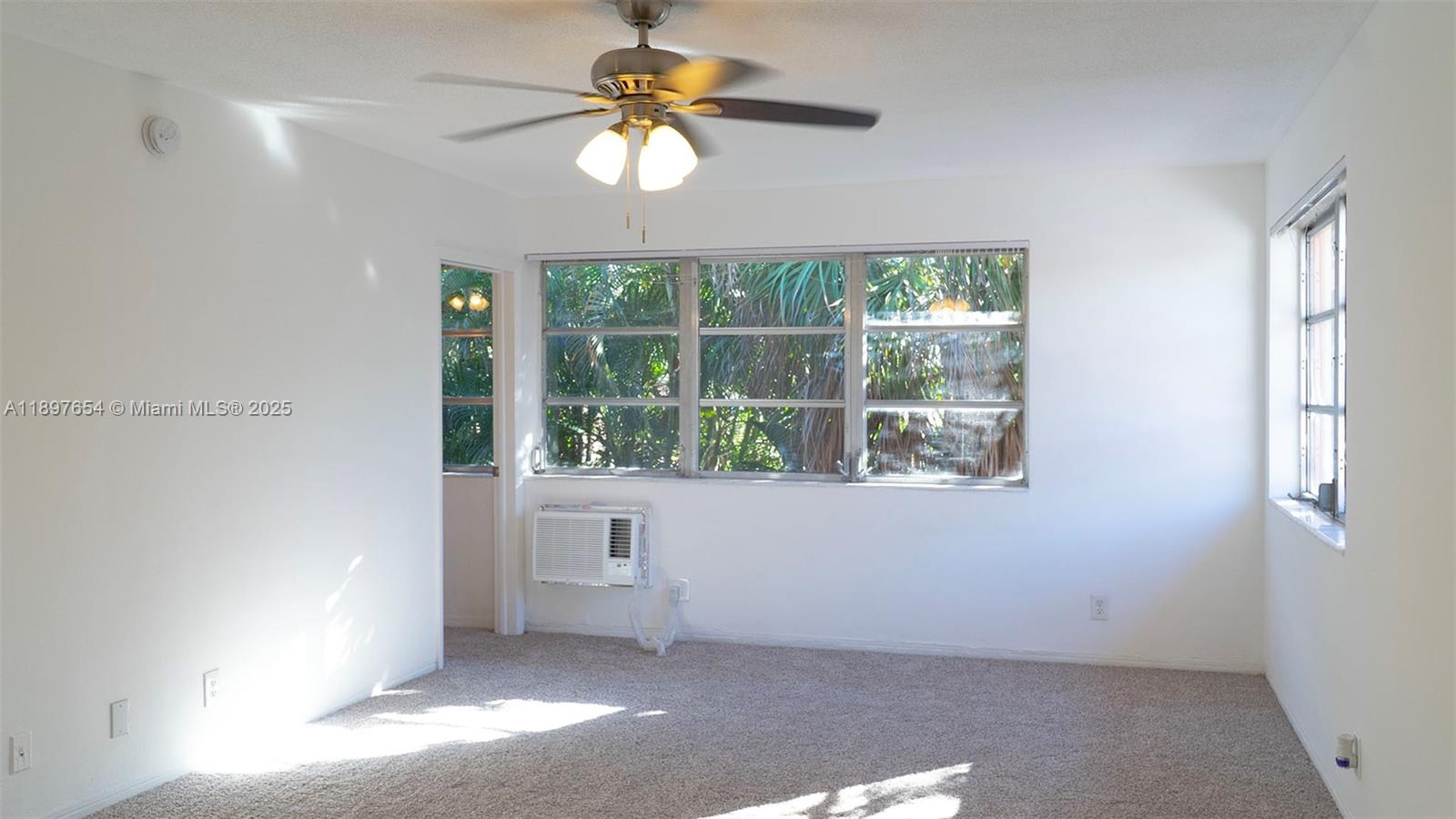 5990 Northeast 18th Avenue, Unit 505 Fort Lauderdale, FL 33334 - Photo 11 of 14 an empty room with a window