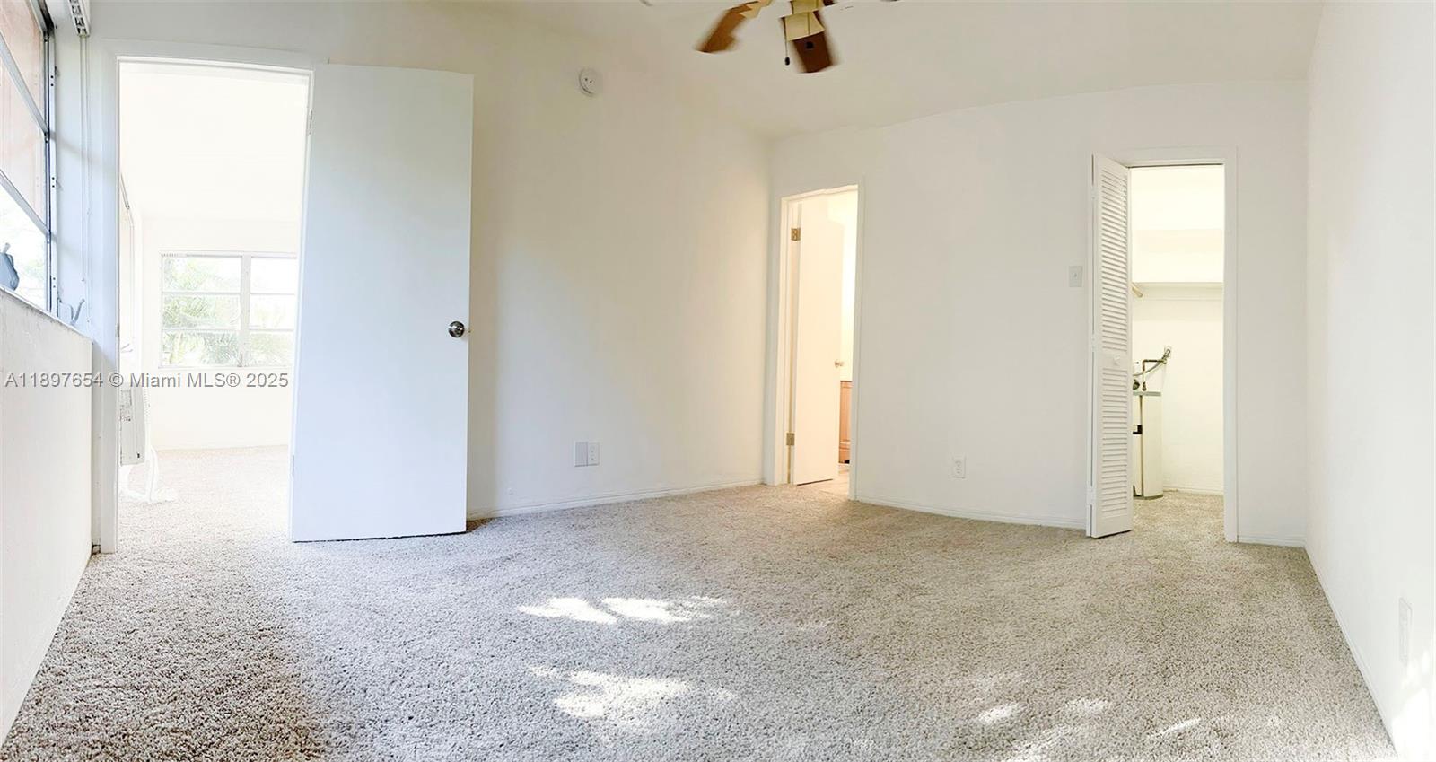 5990 Northeast 18th Avenue, Unit 505 Fort Lauderdale, FL 33334 - Photo 13 of 14 an empty room with windows