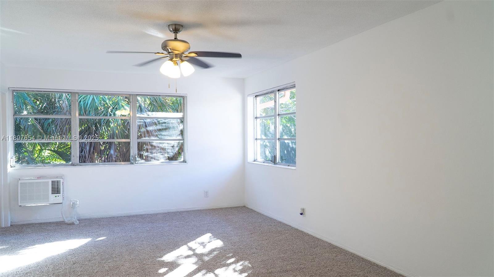 5990 Northeast 18th Avenue, Unit 505 Fort Lauderdale, FL 33334 - Photo 10 of 14 an empty room with a window