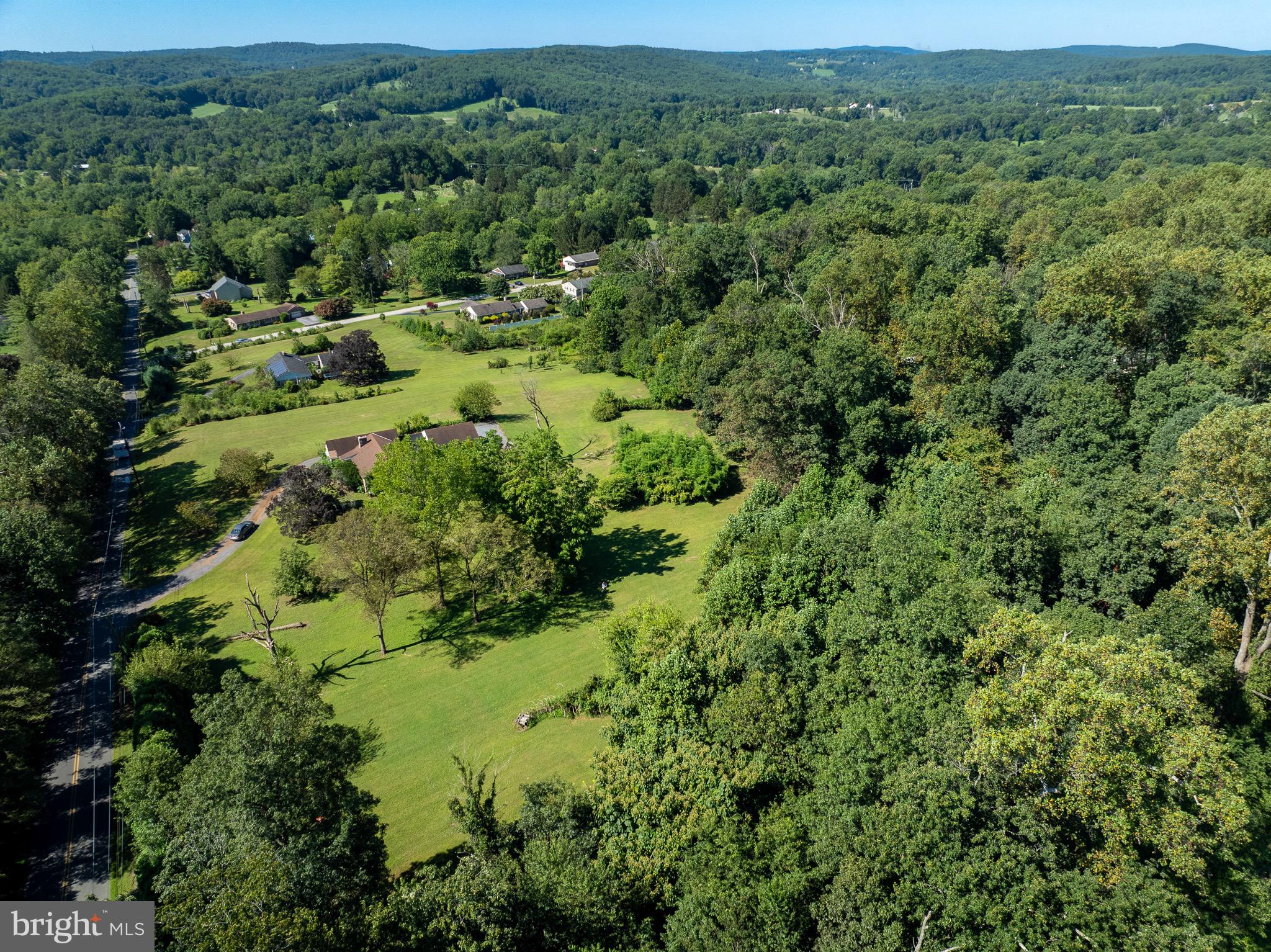 3251 Coventryville Road Pottstown, PA 19465 - Photo 1 of 11 an aerial view of a forest with houses