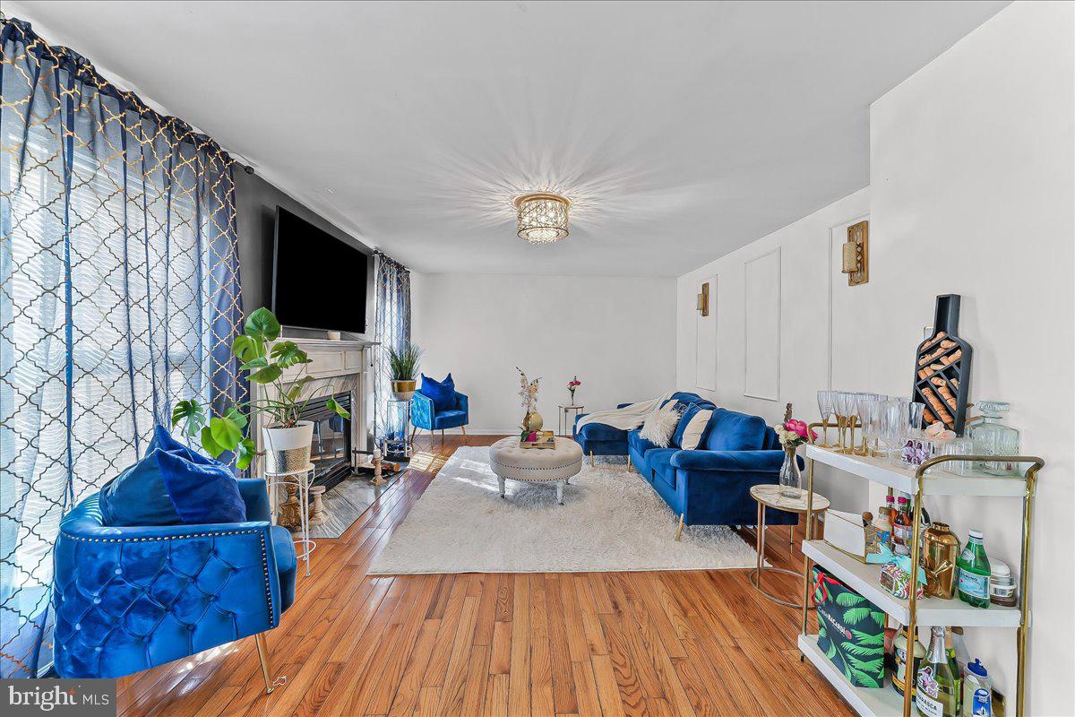 9 Corralberry Road Newark, DE 19702 - Photo 11 of 37 a living room with furniture and a flat screen tv