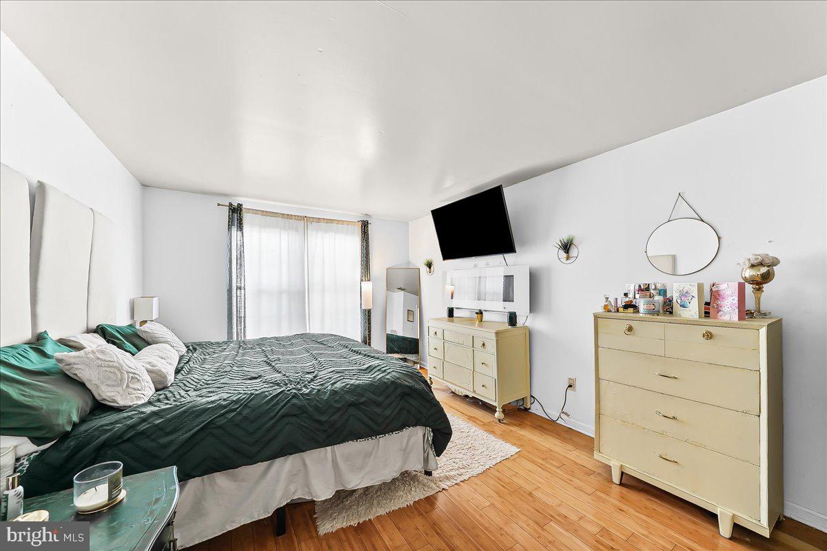 9 Corralberry Road Newark, DE 19702 - Photo 16 of 37 a bedroom with a bed and wooden floor