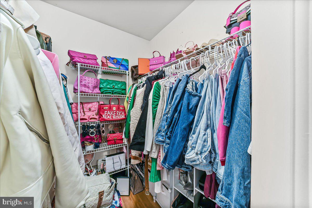9 Corralberry Road Newark, DE 19702 - Photo 19 of 37 a view of a walk in closet with clothes