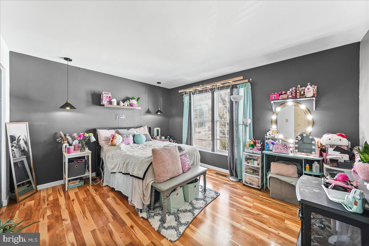 9 Corralberry Road Newark, DE 19702 - Photo 23 of 37 a bedroom with furniture and a bed