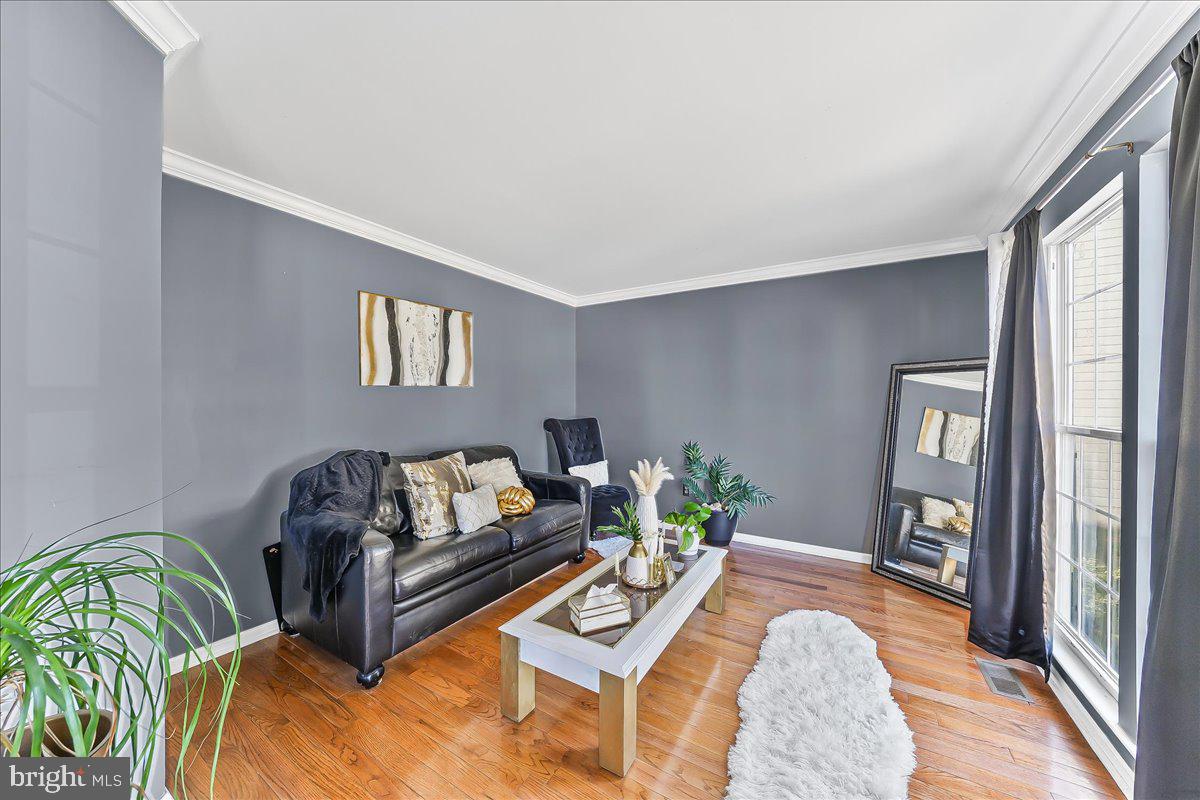 9 Corralberry Road Newark, DE 19702 - Photo 27 of 37 a living room with furniture and a wooden floor