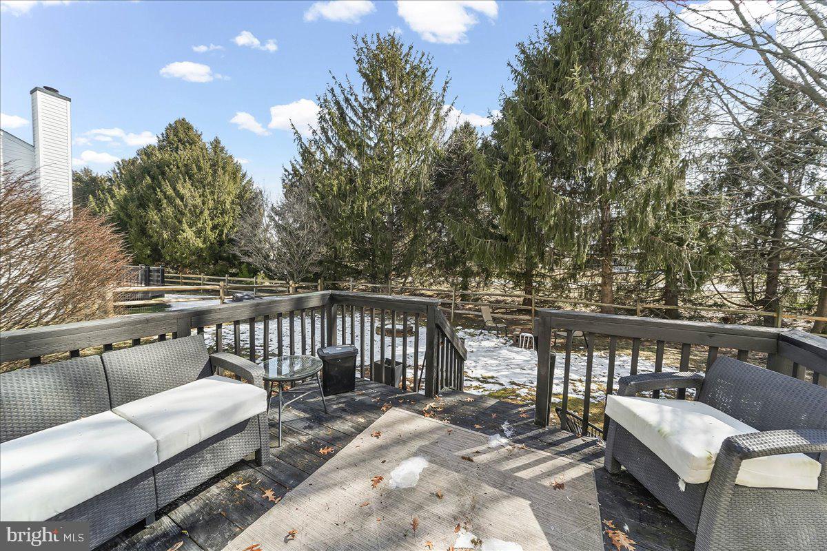 9 Corralberry Road Newark, DE 19702 - Photo 37 of 37 a balcony with wooden floor and outdoor seating