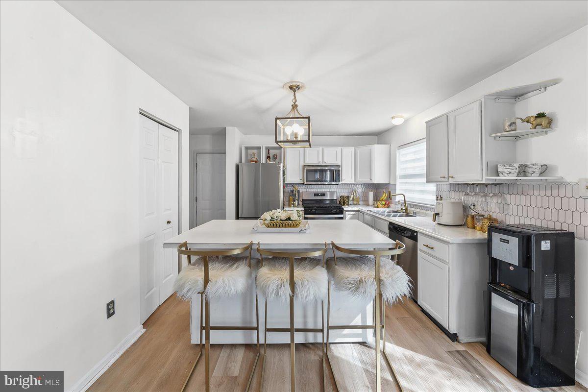 9 Corralberry Road Newark, DE 19702 - Photo 8 of 37 a view of kitchen with sink microwave and refrigerator