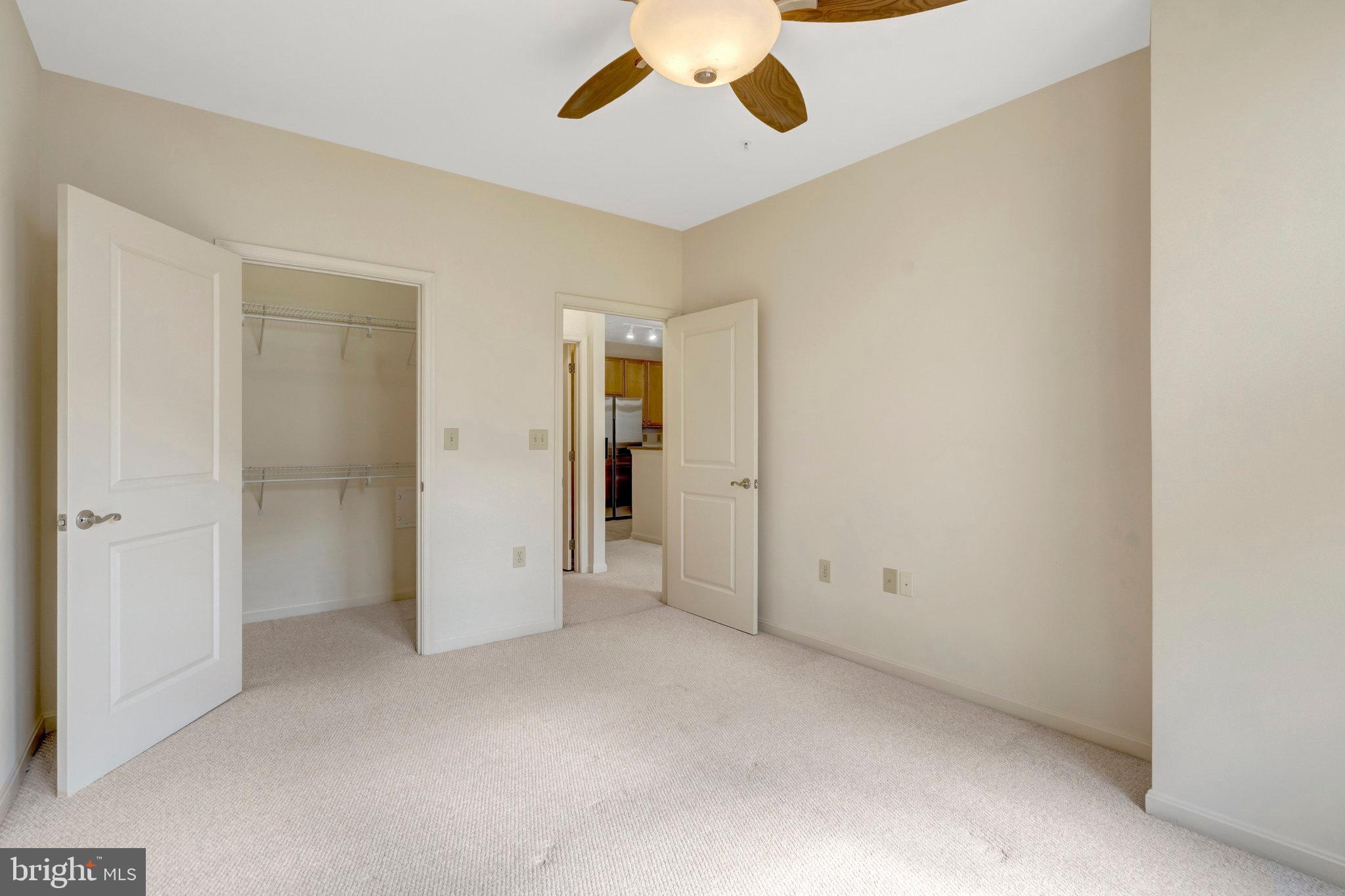 2665 Prosperity Avenue, Unit 345 Fairfax, VA 22031 - Photo 13 of 33 an empty room with closet and a ceiling fan