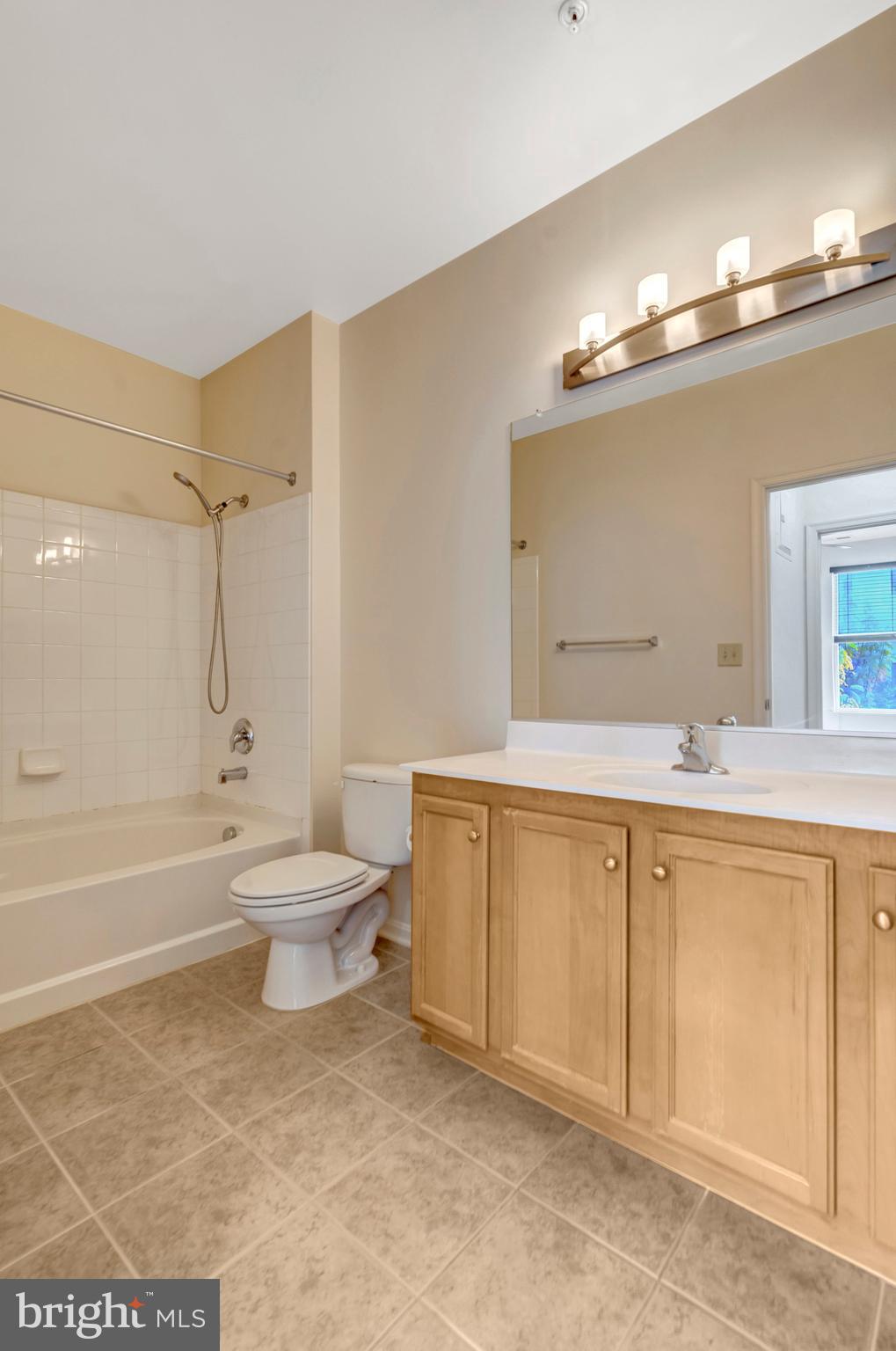 2665 Prosperity Avenue, Unit 345 Fairfax, VA 22031 - Photo 15 of 33 a bathroom with a sink a toilet and bathtub