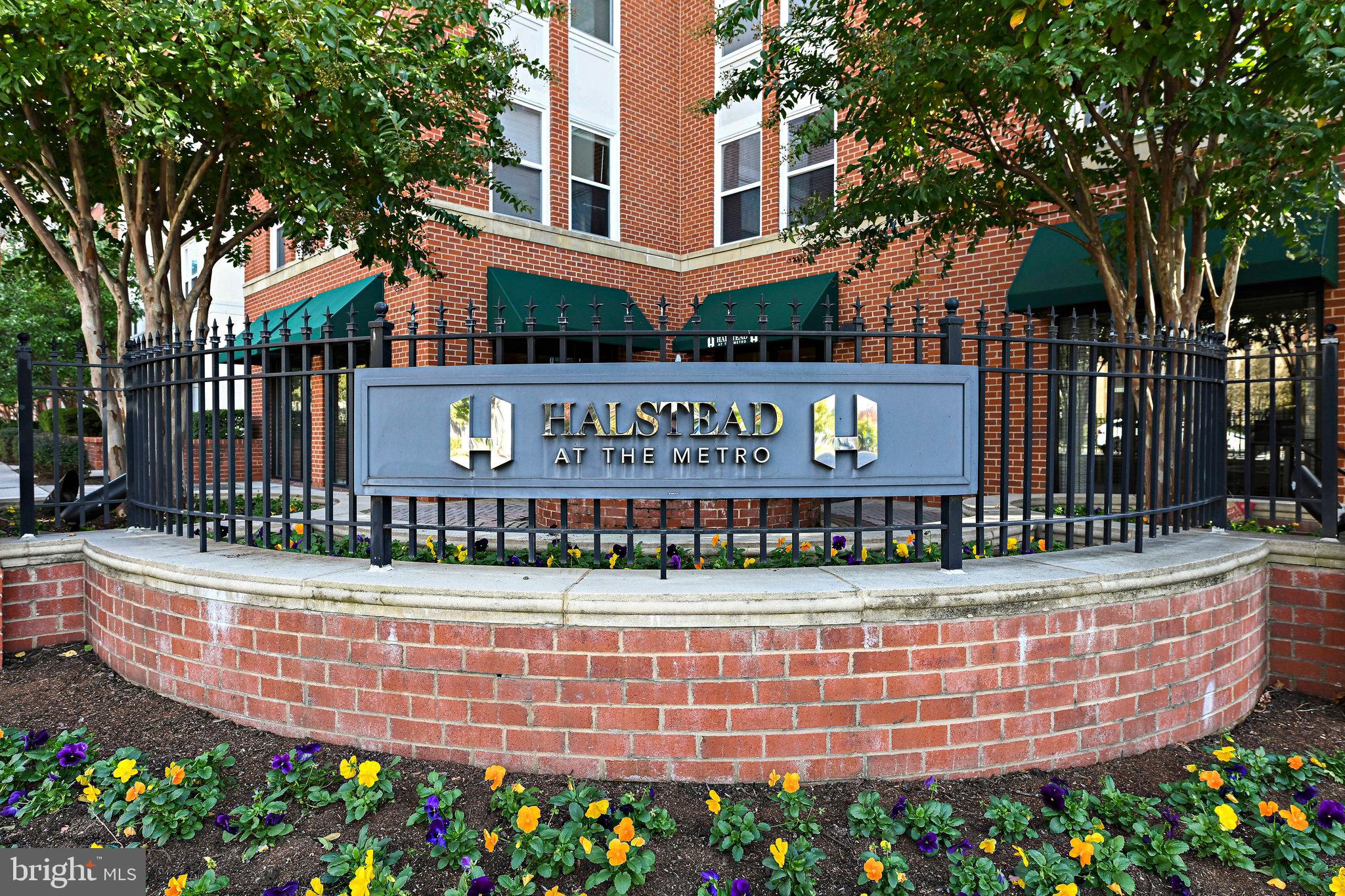 2665 Prosperity Avenue, Unit 345 Fairfax, VA 22031 - Photo 2 of 33 a view of a brick wall with an outdoor space
