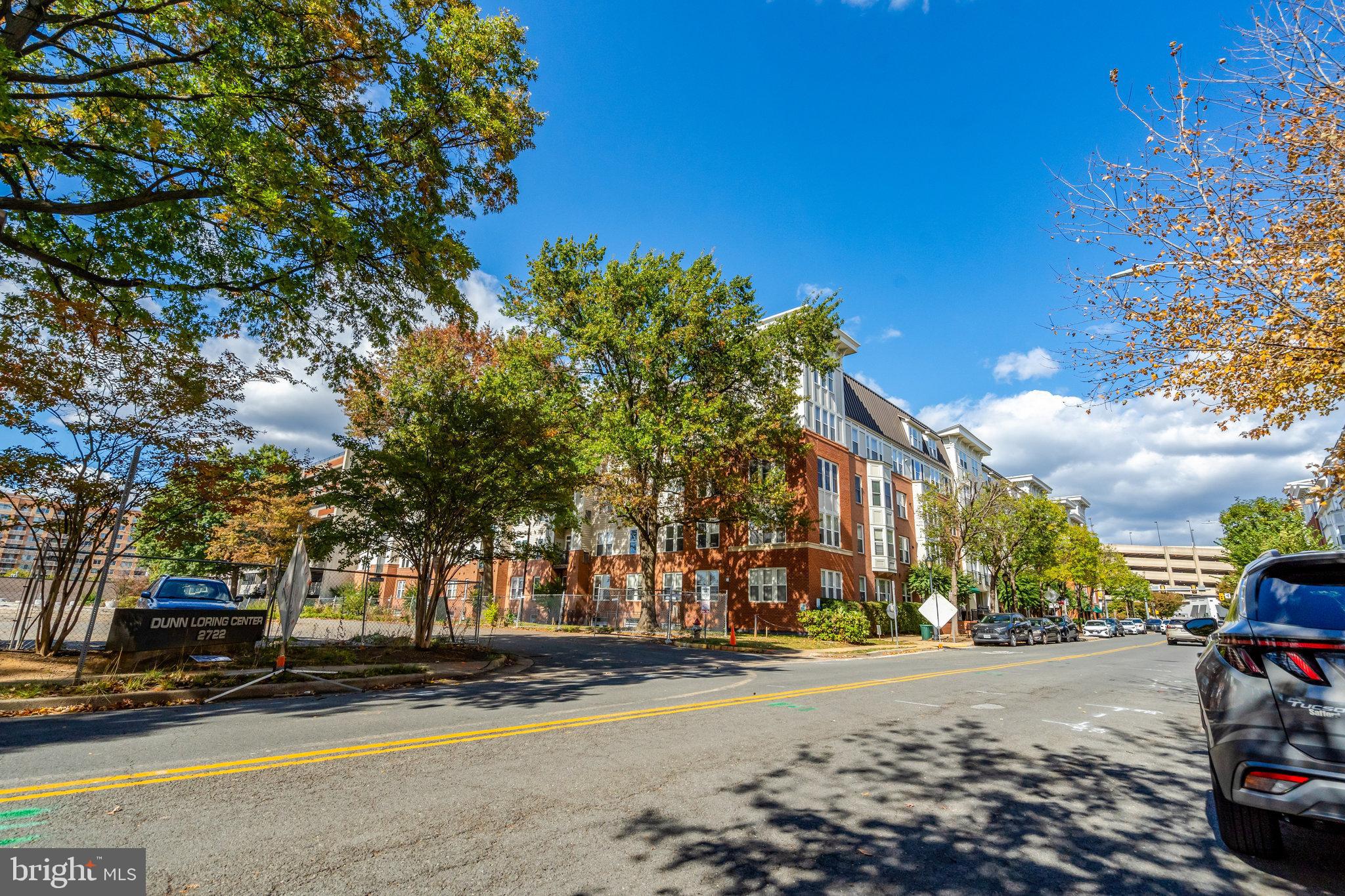 2665 Prosperity Avenue, Unit 345 Fairfax, VA 22031 - Photo 24 of 33 a view of a city street lined with buildings and trees