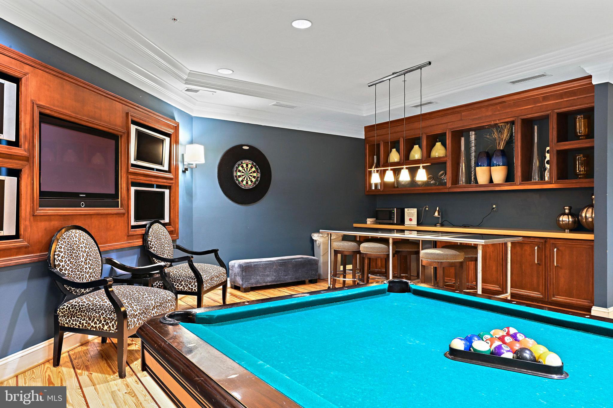 2665 Prosperity Avenue, Unit 345 Fairfax, VA 22031 - Photo 27 of 33 a room with furniture and paintings on the wall