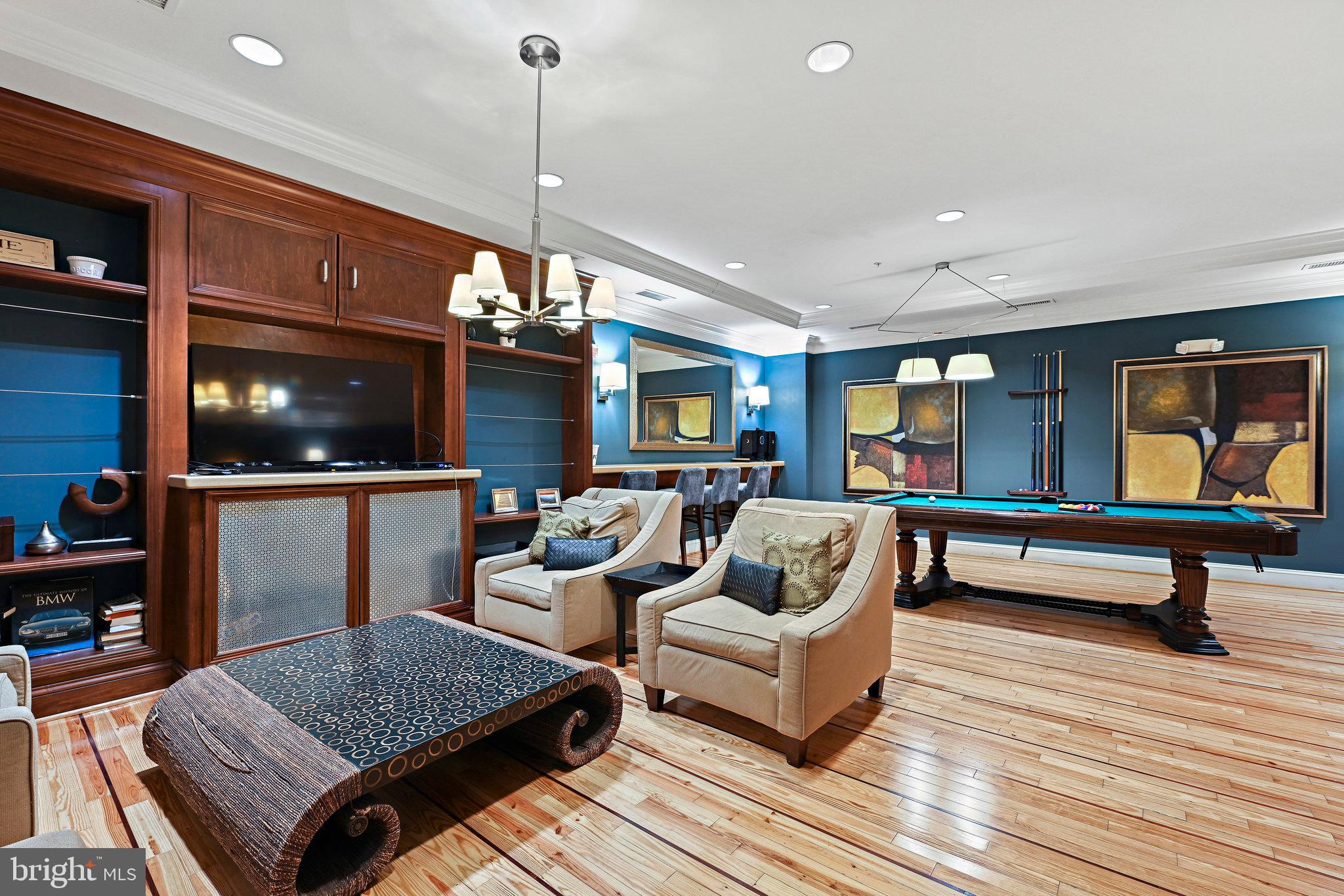 2665 Prosperity Avenue, Unit 345 Fairfax, VA 22031 - Photo 28 of 33 a living room with furniture and a flat screen tv