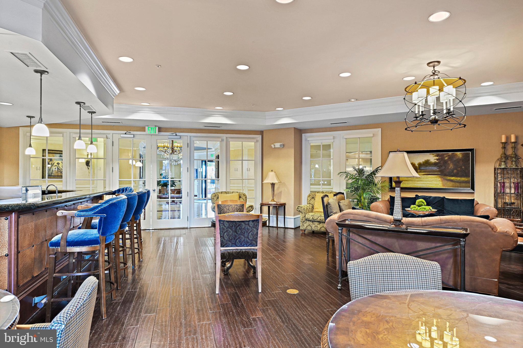 2665 Prosperity Avenue, Unit 345 Fairfax, VA 22031 - Photo 29 of 33 a living room with fireplace furniture and a chandelier