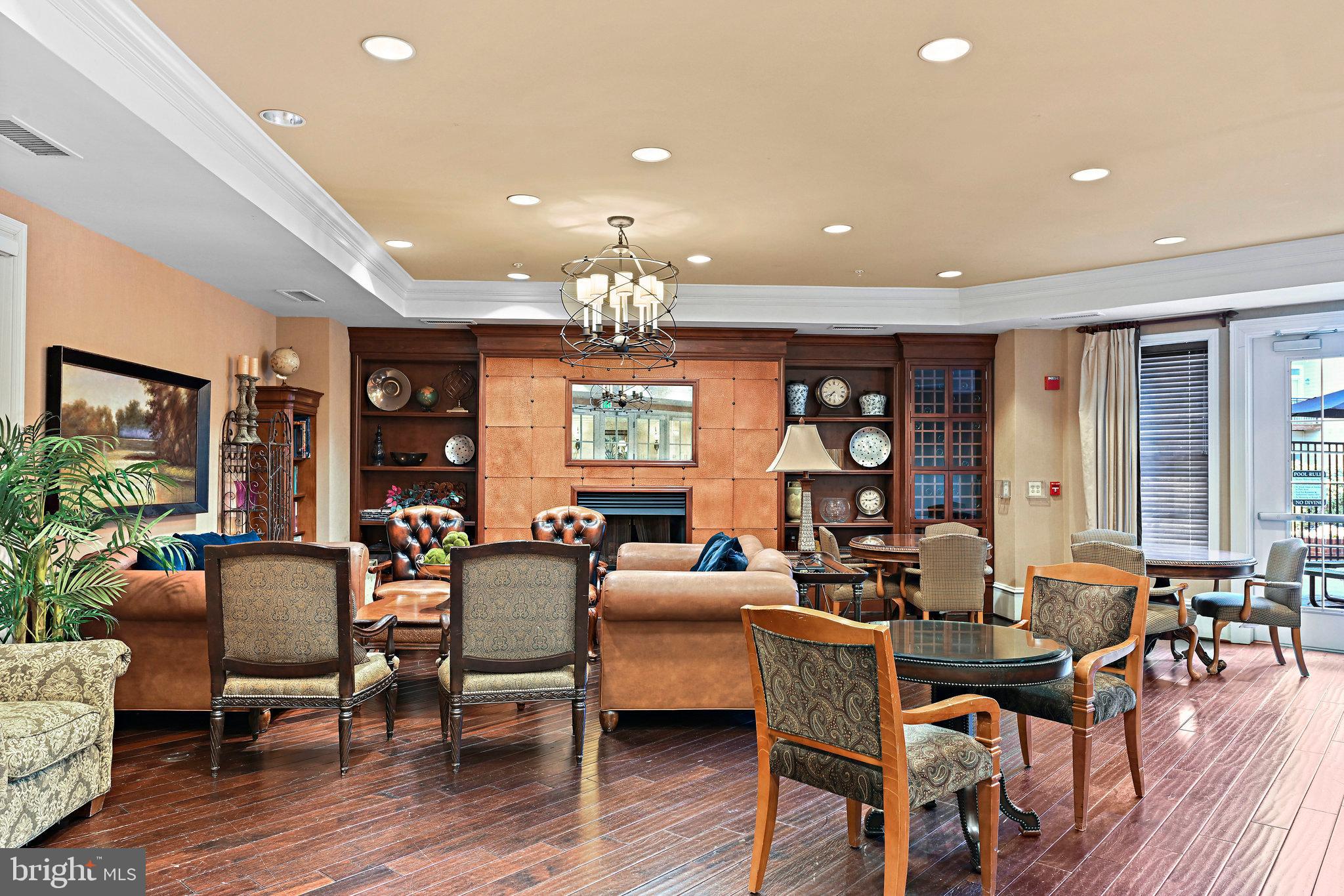 2665 Prosperity Avenue, Unit 345 Fairfax, VA 22031 - Photo 30 of 33 a view of a dining room with furniture window and wooden floor