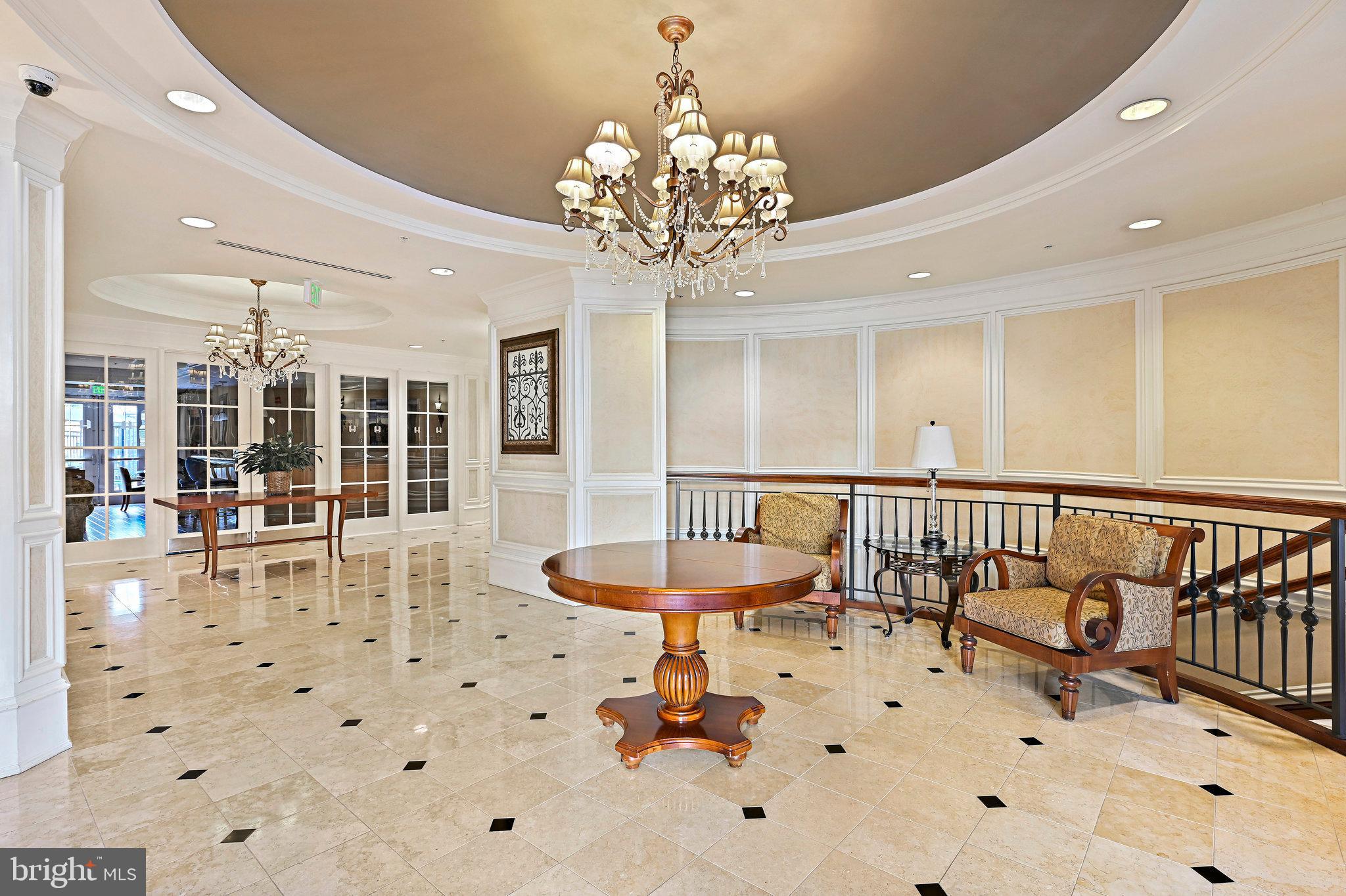 2665 Prosperity Avenue, Unit 345 Fairfax, VA 22031 - Photo 32 of 33 a very nice looking dining room with a large glass table and chairs