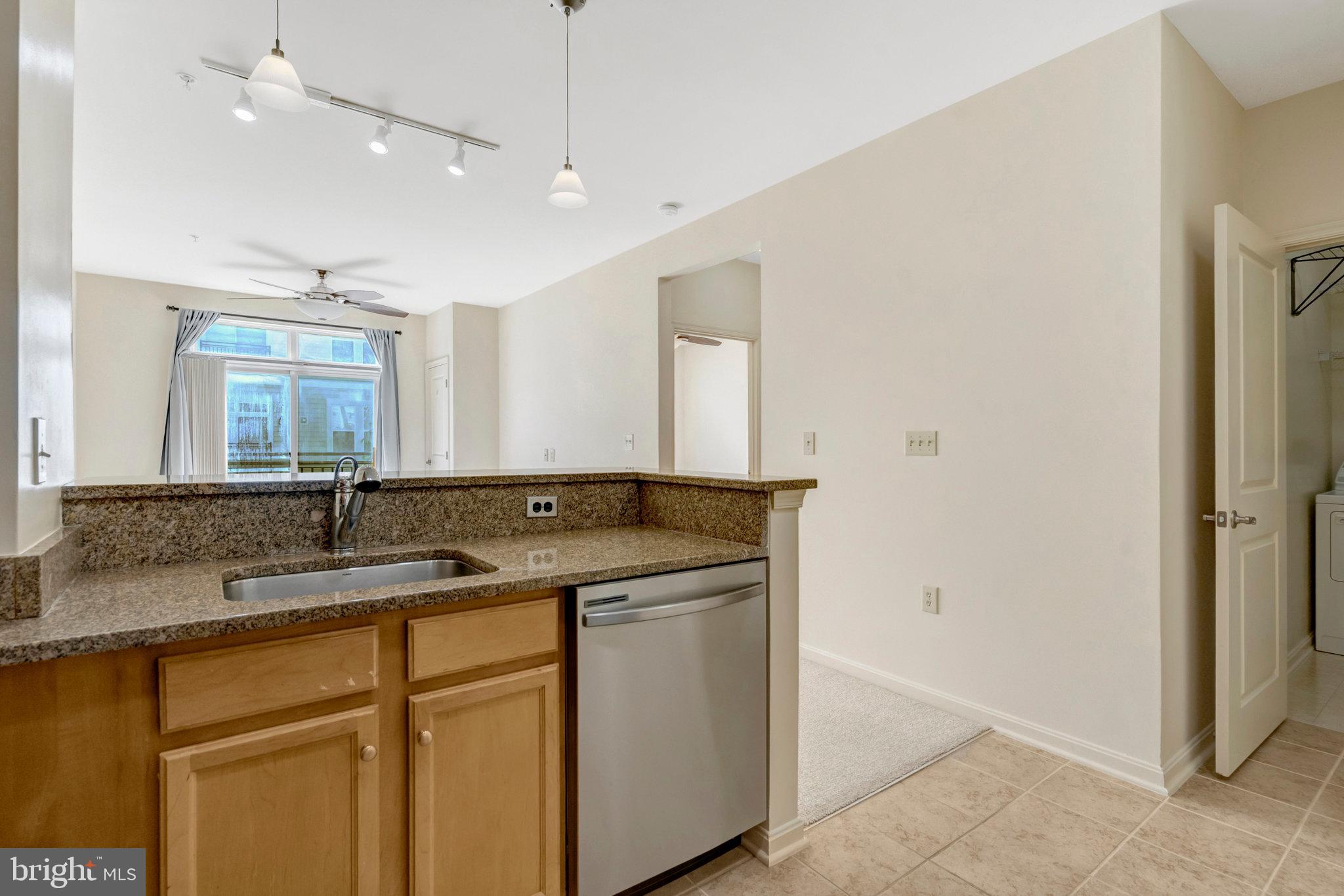 2665 Prosperity Avenue, Unit 345 Fairfax, VA 22031 - Photo 6 of 33 a bathroom with a sink and a mirror