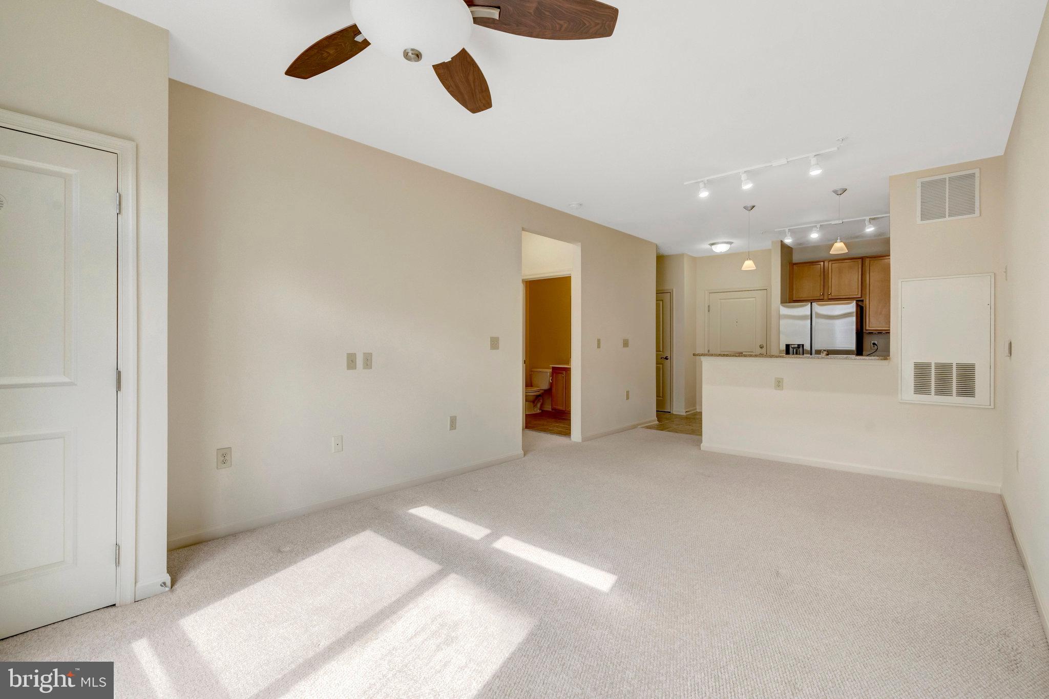 2665 Prosperity Avenue, Unit 345 Fairfax, VA 22031 - Photo 10 of 33 a view of a livingroom with a kitchen