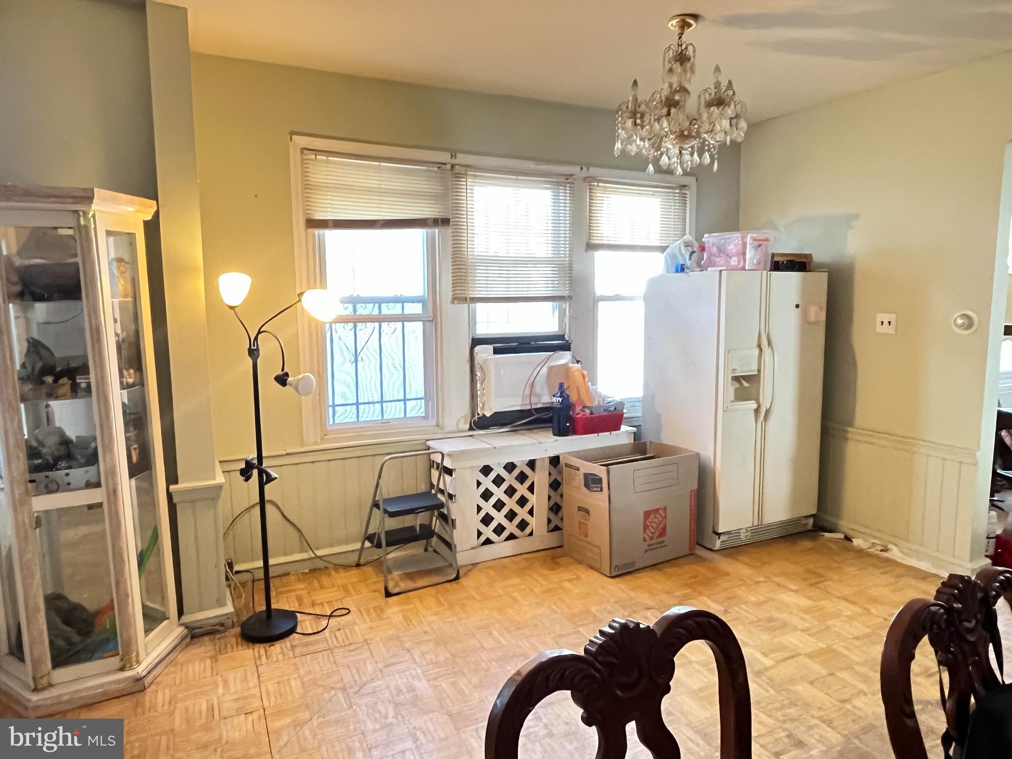 5726 Old 2nd Street Philadelphia, PA 19120 - Photo 4 of 21 a bedroom with furniture and a chandelier