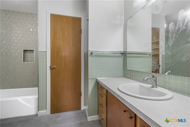 a bathroom with a sink and a bathtub