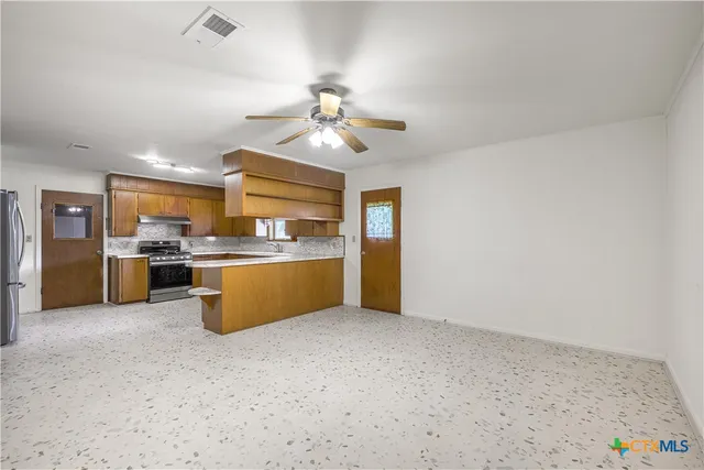a view of kitchen with cabinets