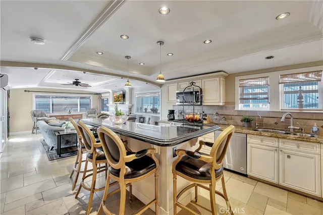 a bedroom with a bed and a mirror on the dresser