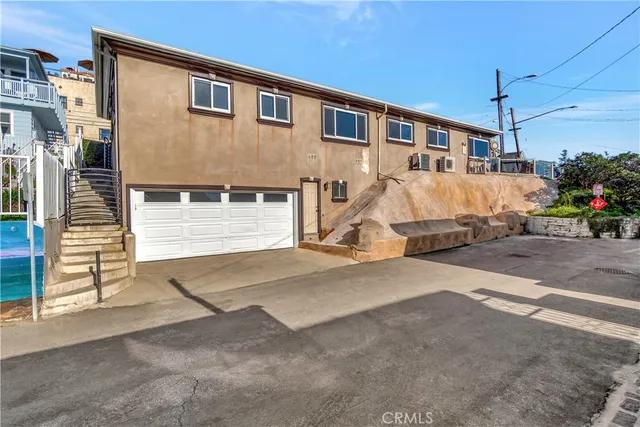 an aerial view of a house with a ocean view