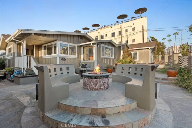 a view of a balcony with wooden floor and furniture