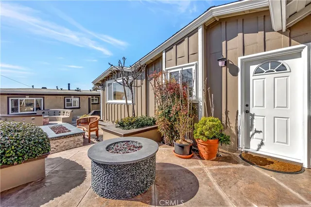a balcony with furniture and a potted plant