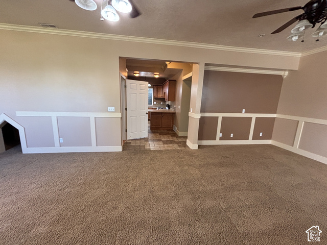 232 Bugle Way Providence, UT 84332 - Photo 21 of 36 Crown molding accents spacious living area with board and batten wall detailing