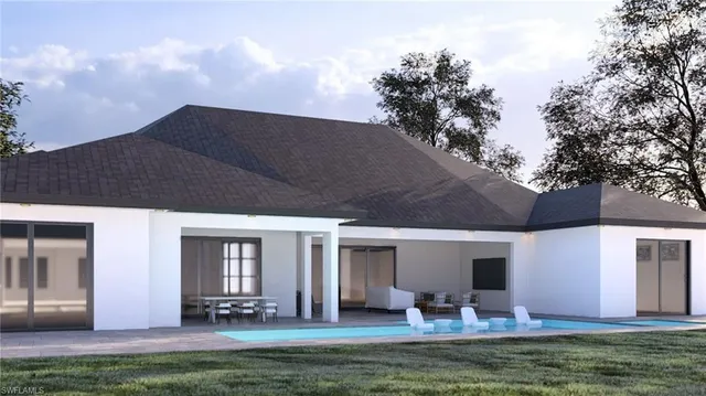 a swimming pool view with couple of outdoor seating