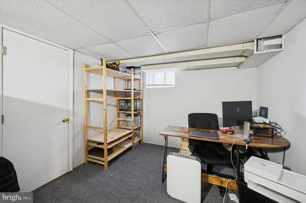 a view of a workspace with furniture