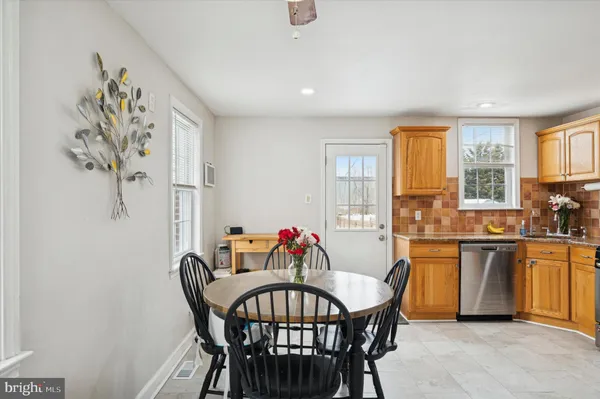 a view of a dining room with furniture window and outside view