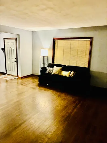 a room with a bed and window