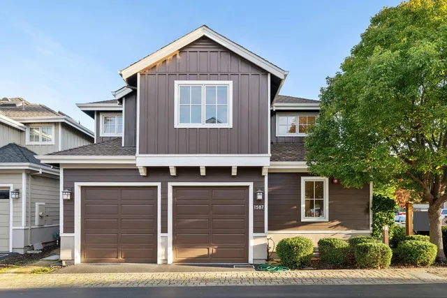 a front view of a house with garden