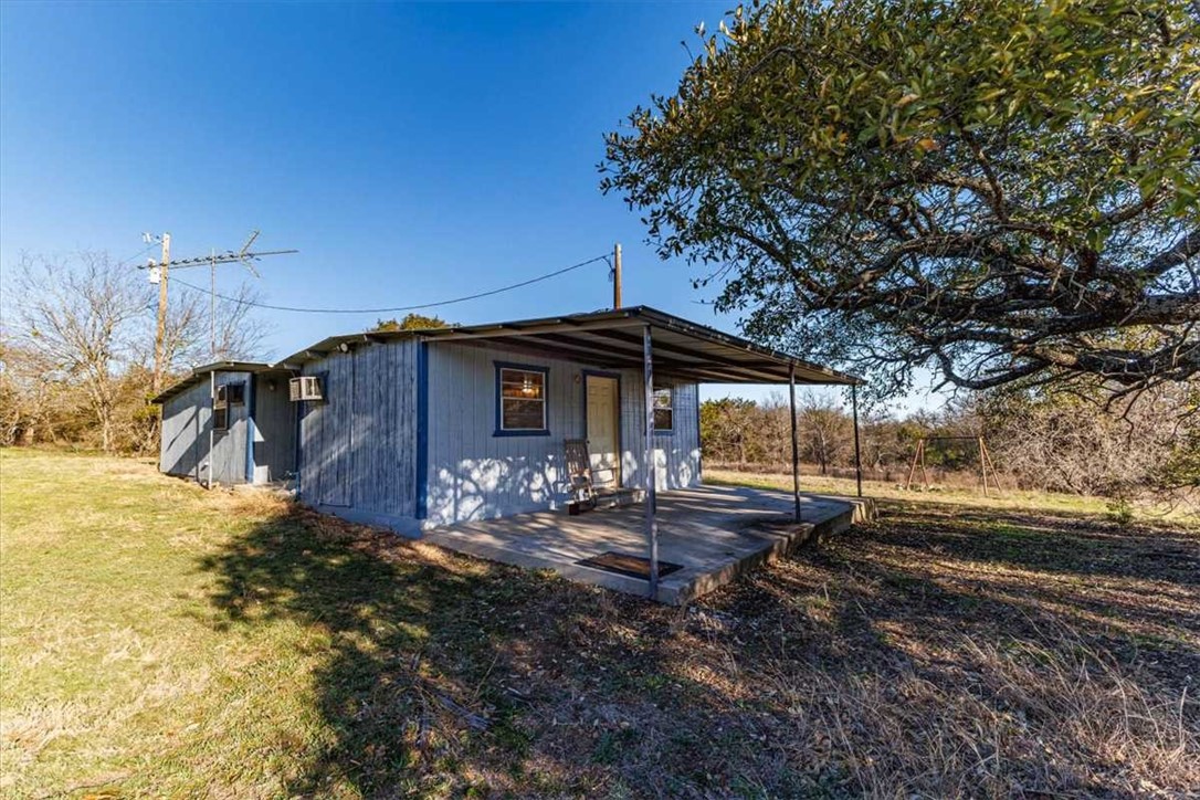 2998 Straws Mill Road Gatesville, TX 76528 - Photo 48 of 77 a view of a house with backyard and trees