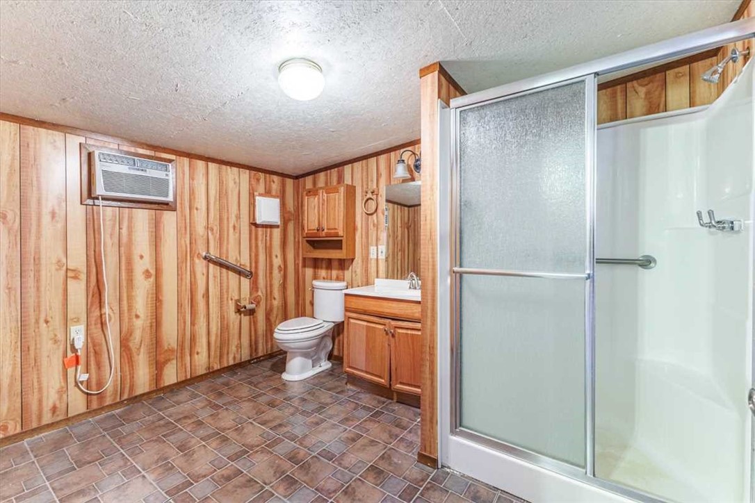 2998 Straws Mill Road Gatesville, TX 76528 - Photo 55 of 77 a bathroom with a toilet a sink and a shower