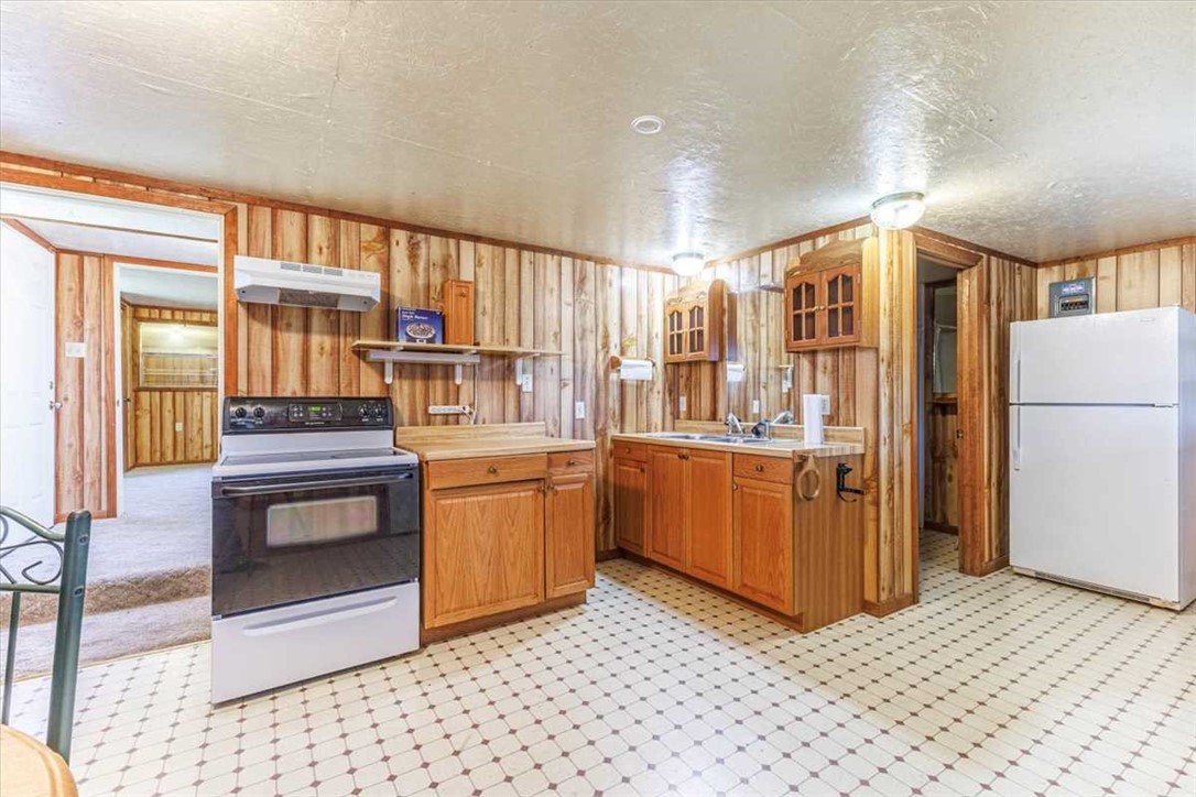 2998 Straws Mill Road Gatesville, TX 76528 - Photo 63 of 77 a kitchen with stainless steel appliances granite countertop a refrigerator and a stove top oven