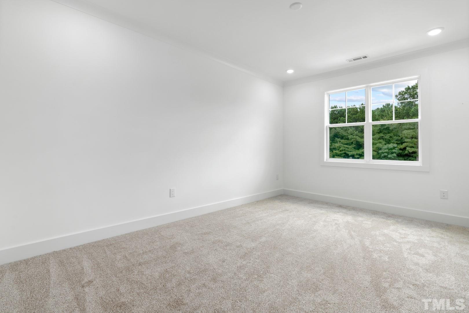 6118 Fox Road Raleigh, NC 27616 - Photo 22 of 32 an empty room with a window