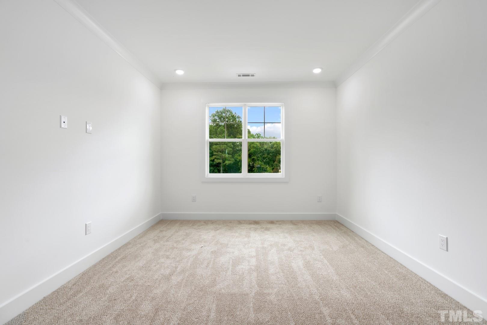 6118 Fox Road Raleigh, NC 27616 - Photo 26 of 32 an empty room with large windows