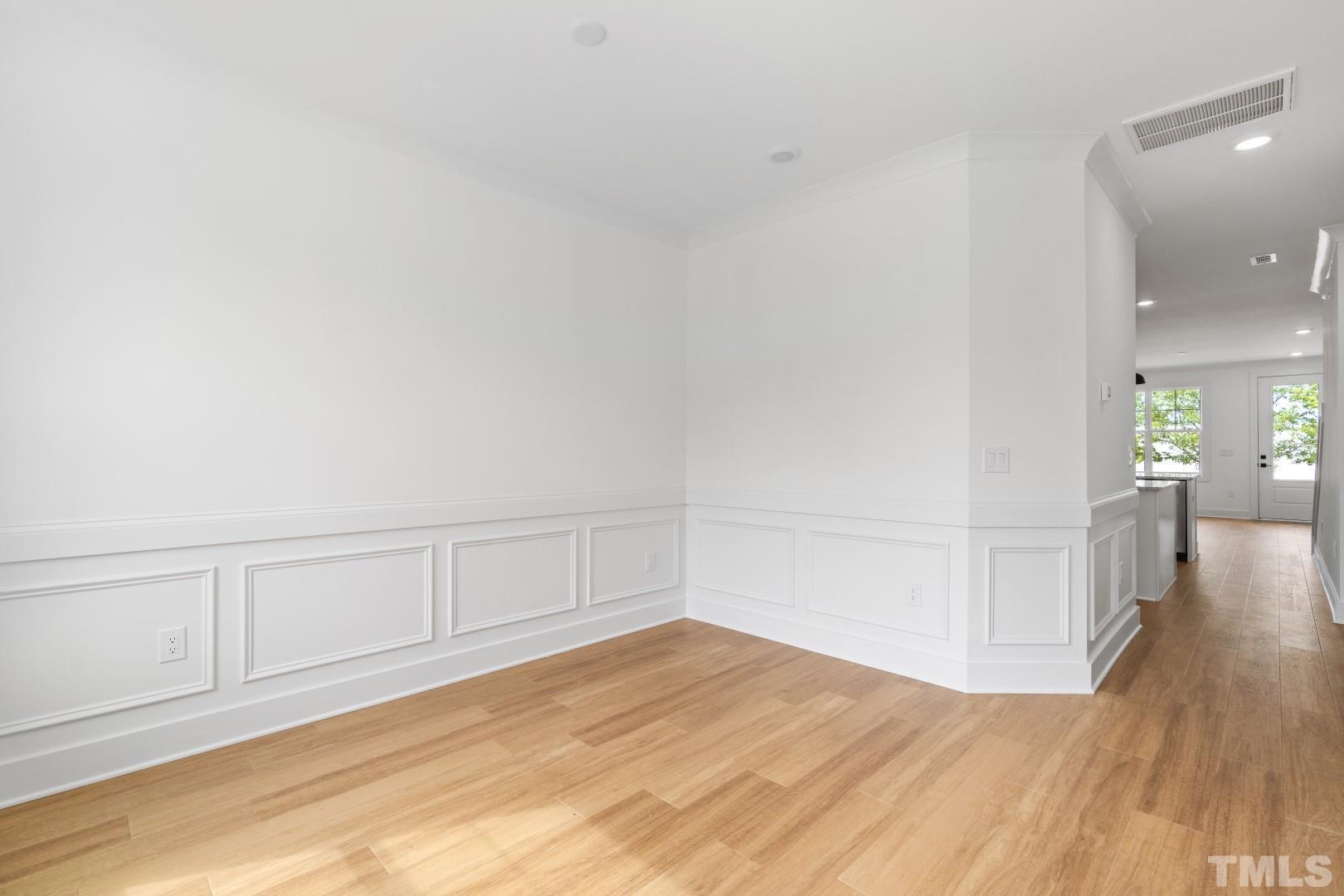 6118 Fox Road Raleigh, NC 27616 - Photo 6 of 32 a view of a livingroom with wooden floor
