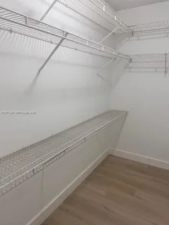 a view of a room with racks on the wall